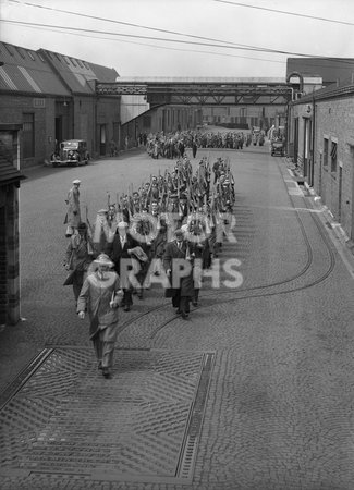 Men Marching Through Yard